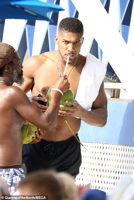 Anthony Joshua Displays His Ripped Physique As He Goes Shirtless On The