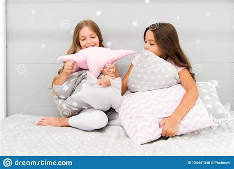 girls happy friends with cute pillows pillow fight pajama