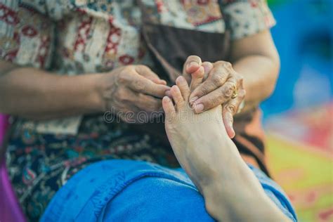 thai foot massage on street for resting place on annual festival stock