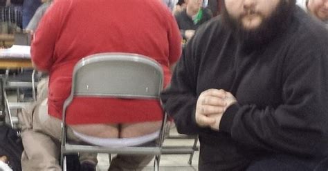 man goes to magic the gathering tournament poses next to butt cracks funny the gathering
