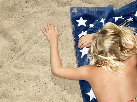 girl on towel at the beach stock image f003 8966 science photo