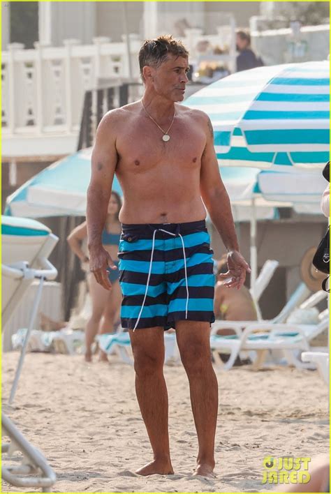 full sized photo of rob lowe shows of fit shirtless figure beach 15