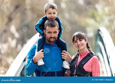 happy young family   camera  spending time outdoor  spring stock photo image