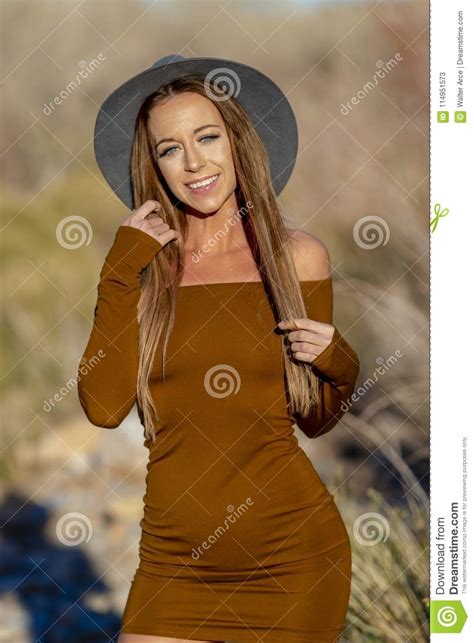 beautiful blonde model posing outdoors in the desert stock