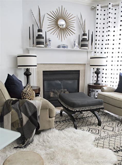 stunning black and white living room mantle decorated for