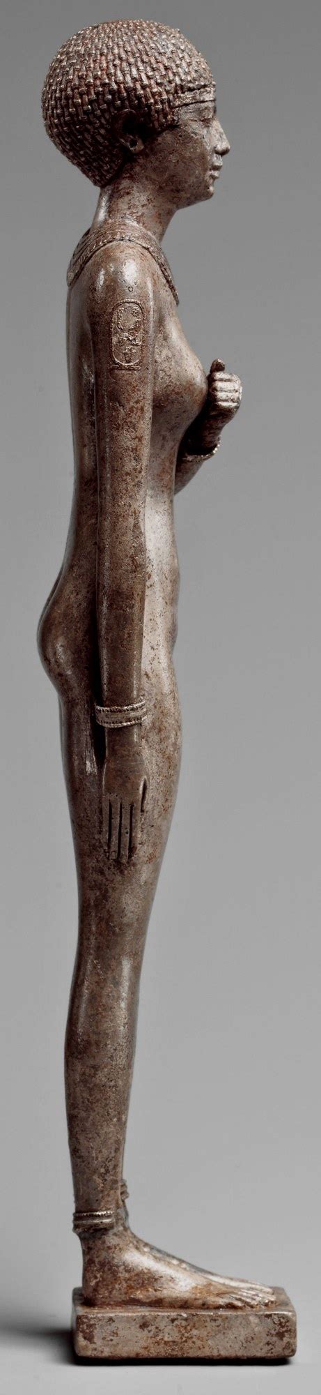 statue of a royal woman with cartouches of necho ii on her arms egypt