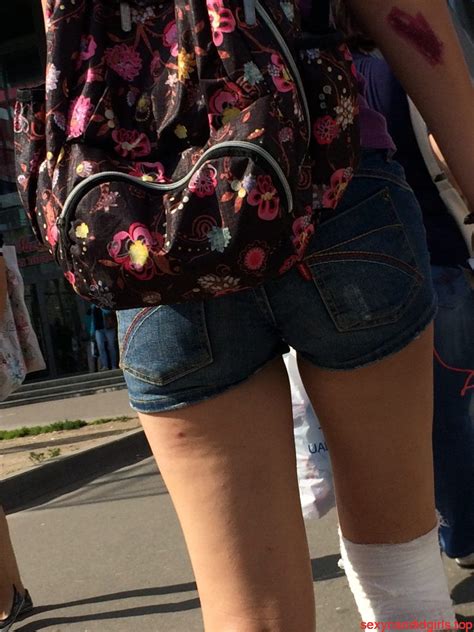 teen in denim mini shorts with a scratched knee in a bus