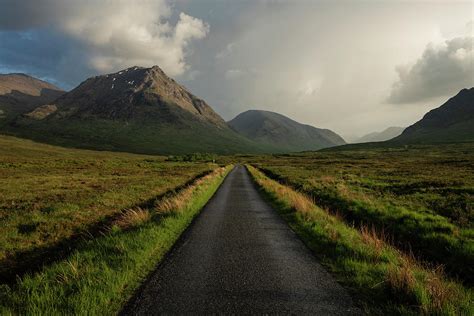 single track road leading  glen etive highland scotland photograph