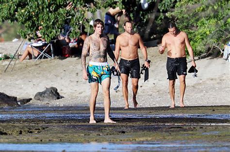 Justin Bieber’s Shirtless Photos From Beach Day With Friends In Hawaii
