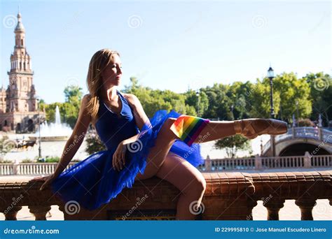 Classical Ballet Dancer And Lesbian Leaning On A Railing In A Park She