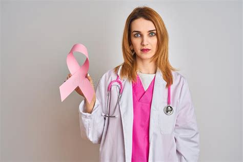 Redhead Caucasian Doctor Woman Wearing Pink Stethoscope Over Isolated
