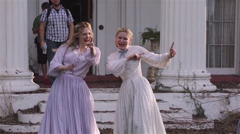 elle fanning and kirsten dunst have fun on set the