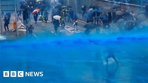hong kong blue dyed water fired at protesters defying ban bbc news
