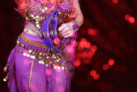 Belly Dancer Wearing Purple Dance Costume Close Up With Bokeh Stock
