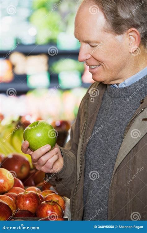 man holding  apple royalty  stock  image