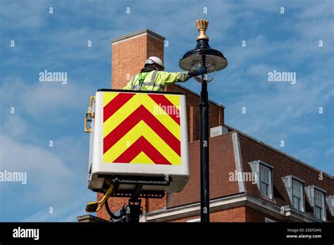 london uk  aug  fm conway contractor installs   top part   street light
