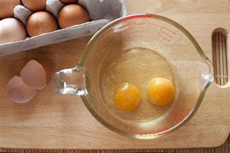 cracked eggs   measuring jug  stock image