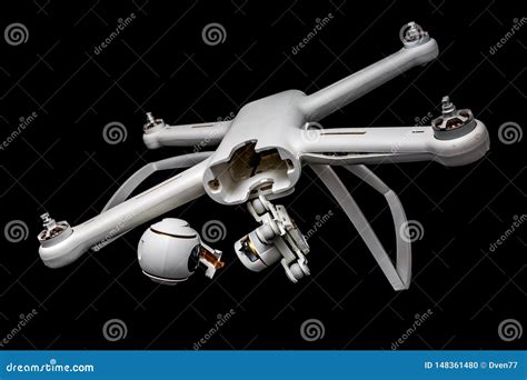 broken white drone   fall isolated   black background damaged body motor