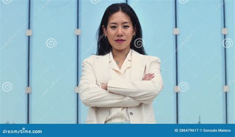 Portrait Of Asian Business Woman With Arms Crossed Looking At Camera