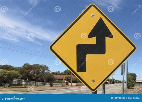 black  yellow road sign warning  sharp turn