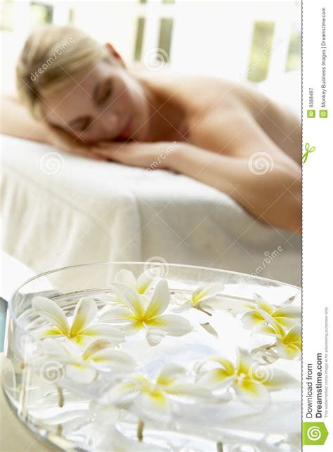 Woman On Massage Table With Flowers In Foreground Stock Image Image