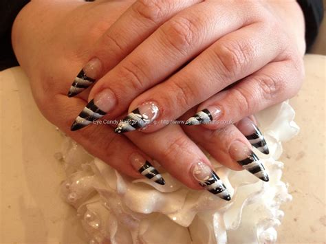 eye candy nails and training stiletto nails with black and white one stroke nail art by nicola