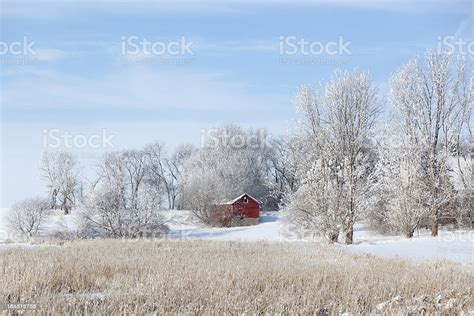 Winter Snowy Farm Scene With Red Barn And Field Stock