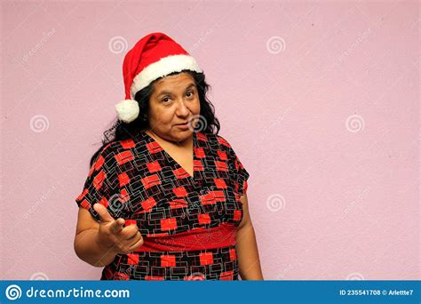 Body Positive Latina Adult Woman Wears Christmas Hat And Shows Her