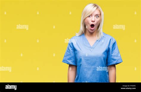 Young Beautiful Blonde Nurse Doctor Woman Over Isolated Background