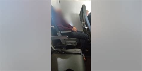 frontier airlines passenger arrested after peeing on seat in front of