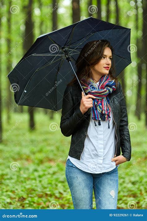 woman with umbrella in the rain stock image image of adult park
