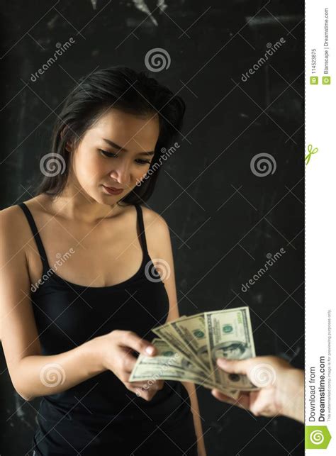 prostitute taking dollar bills pay for sex stock image