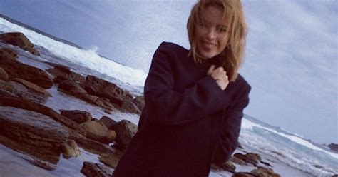 into the blue kylie minogue in sexy beach selfie as she warms up for