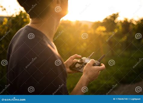 young man flying  drone stock photo image  remote