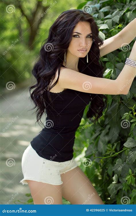 Beautiful Slim Brunette Model Woman Posing On Nature Background Stock