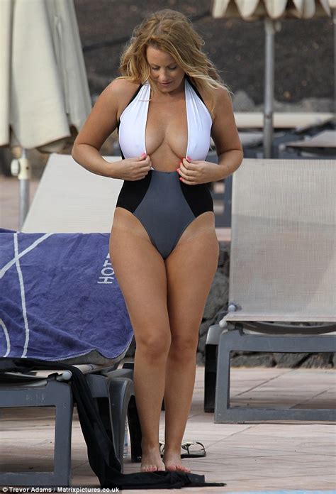 selina waterman smith puts her curves on display in a plunging swimsuit
