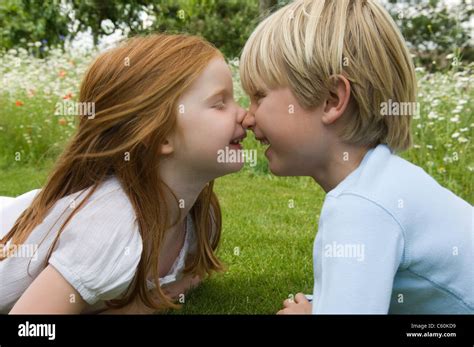 children touching noses  field stock photo alamy