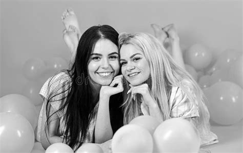 Friendship Concept Blonde And Brunette On Smiling Faces Have Fun At