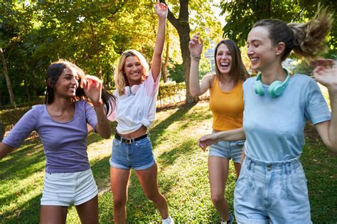 group  laughing multiracial teen female friends  fun
