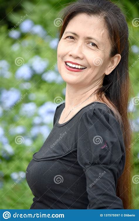 Older Filipina Female Senior And Happiness Stock Image