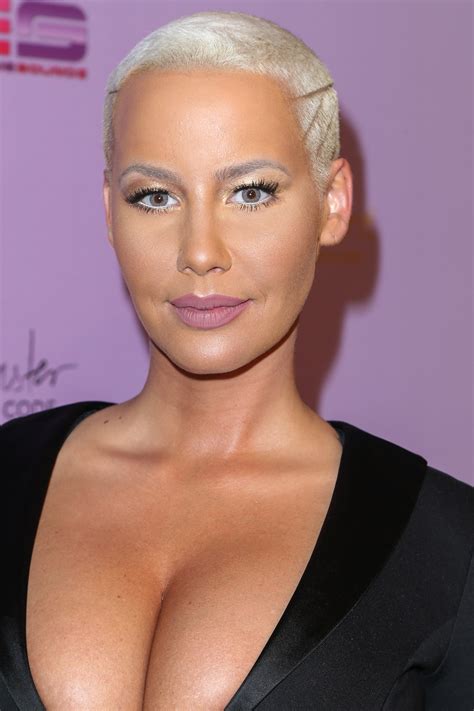 amber rose flaunts cleavage in super low cut dress at