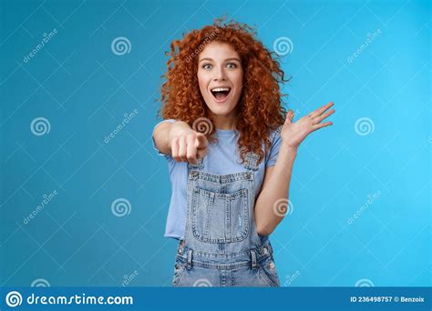 excited impressed surprised cute redhead european woman curly