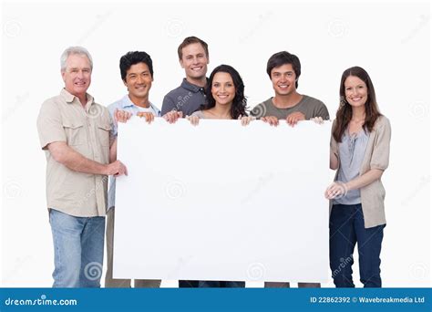 smiling group holding blank sign  stock photography image