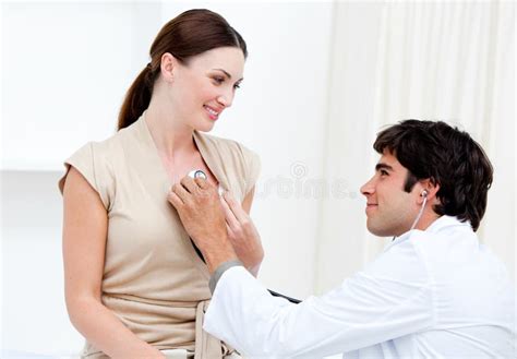 Male Doctor Examining A Female Patient Royalty Free Stock Images