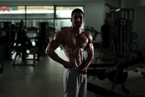 Adult Guy Bodybuilder Posing In Gym Stock Image Image Of Biceps