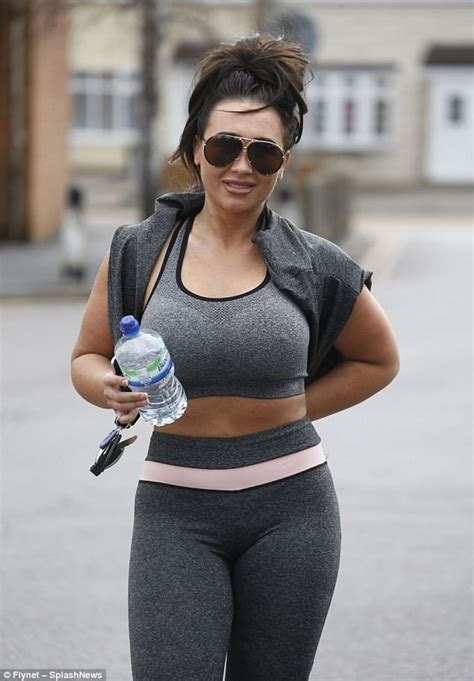 lauren goodger hides her phone as she flaunts her toned abs daily