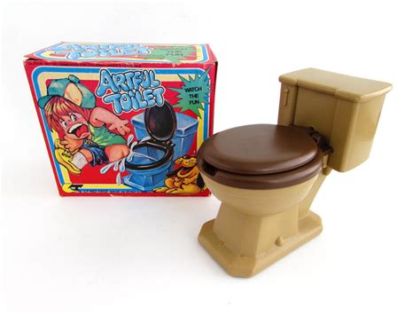 small toy   toilet top    webzine picture