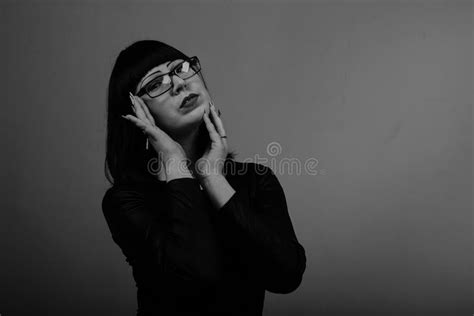 Portrait Of A Beautiful Girl With Glasses Posing For A Photographer In