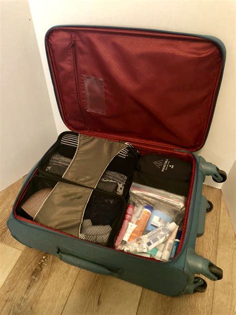 packed international size carry  suitcase exploring  prime