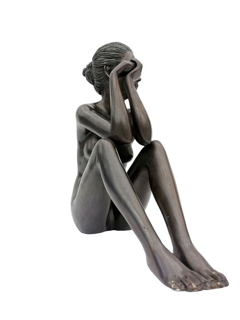 bronze sculpture   sitting woman